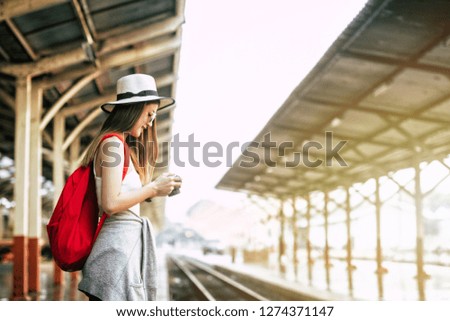 Pictures of a smiling young woman's beautiful way of life in the evening with travel photos from a photographer's camera, a photo shoot with glasses and a hat style. Travel ideas