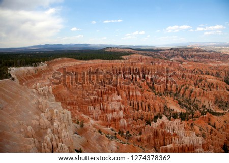 Bryce Amphitheater, Bryce Canyon National Park, Utah, USA. Hoodoos are tall skinny spires of rock that protrude from the bottom of arid basins and "broken" lands.