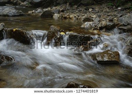 A long-exposure photo of a stream in a mountain, South Korea