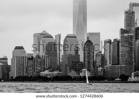 Monochromatic skyline view of Manhattan's financial centre taken while sailing the Hudson River in New York City.