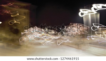 tribute to Ernst Hass, impressionist night photographic sweeps of streets with Christmas lighting, abstract photography at low shutter speed. sensations of celebration and emotion, toledo, spain,