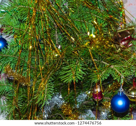 Tree branches are decorated with toys for the new year holiday.