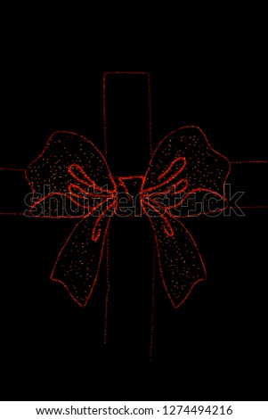 Red bow of LEDs on a black background