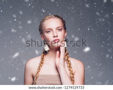 Beautiful woman winter background with long blonde beautiful hair