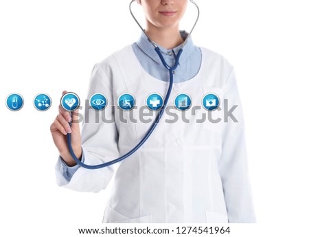Doctor with stethoscope and virtual icons against white background. Medical and health insurance concept