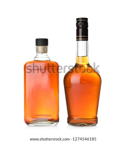 Bottles of scotch whiskey on white background