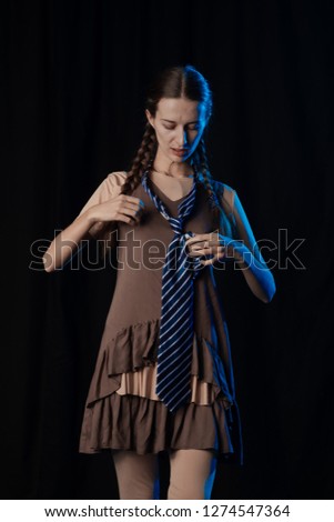 Girl Actress on stage plays emotions in blue theatrical light