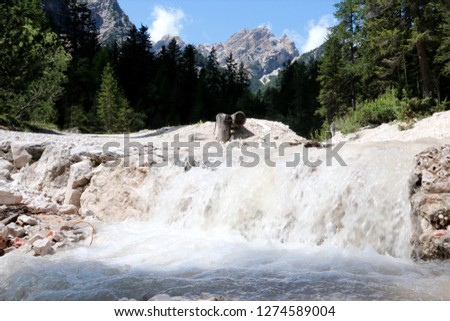 Wild Water River in the dolomites alps Royalty-Free Stock Photo #1274589004