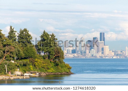 USA, Washington State, Seattle. View of Seattle and Wing Point on Bainbridge Island from ferry. Royalty-Free Stock Photo #1274618320