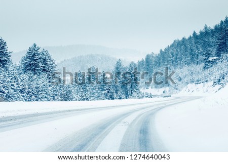 Mountain road landscape covered in snow in winter  Royalty-Free Stock Photo #1274640043