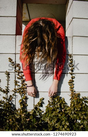 Fashion portrait photography of a young woman. Relaxed vibe with sunshine from the outdoors. 