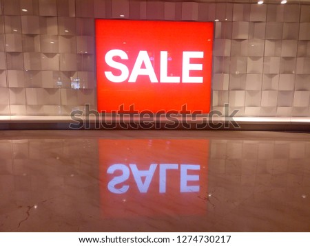 red sale reflection
