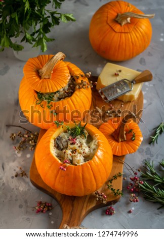 Pumpkins stuffed with meat and mushrooms in bechamel sauce
