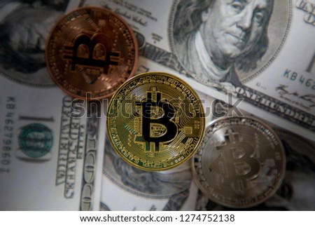 Bitcoin gold coin on background us dollar