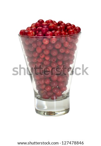 Glass filled with a cowberry isolated on white.