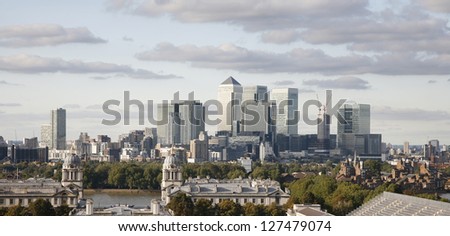 London Skyline seen from Greenwich Park. Overlooking Canary Wharf with Maritime Museum.