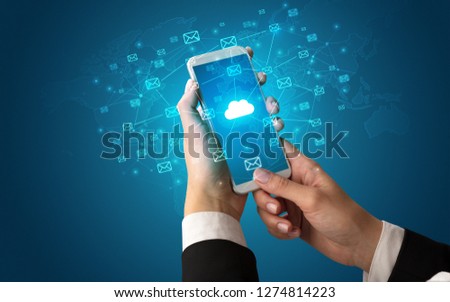 Female hand using smartphone with cloud, message and global concept