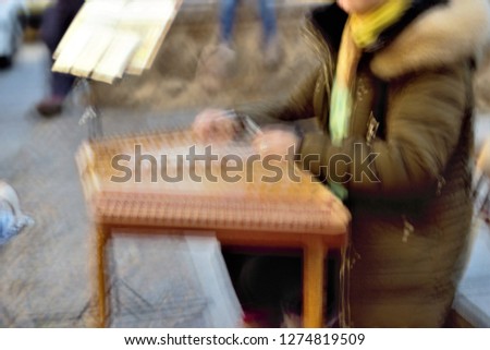 Tribute to Monet and Ernst Hass, impressionist photograph of street music, impressionist and abstract photographic sweeps feeling of movement, of life, toledo, spain,