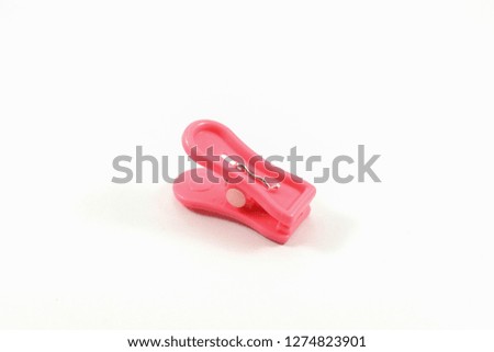 Pink cloth clamps placed on a isolated white background