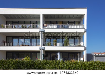 modern appartment architecture in south german bavaria autumn sunshine day Royalty-Free Stock Photo #1274833360