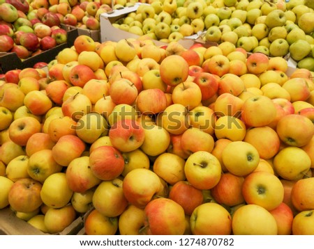 Ripe apples in the store as background .