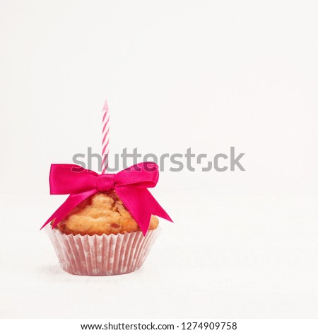 Birthday cupcake with candle on white background 