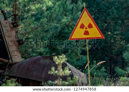 sign of radiation hazard on the background of radioactive garbage