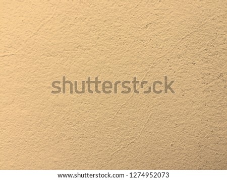 Yellow clean wall texture background.Beautiful concrete stucco. painted cement Surface design banners.abstract shape and copy space for text.