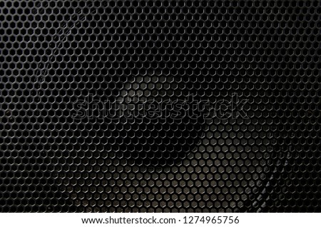 Fragment of the speaker with a metal perforated grille. Great background for advertising and design Royalty-Free Stock Photo #1274965756