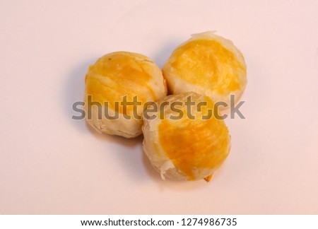 Thai desserts on white background.Spring Roll pastry with nuts, salted eggs.