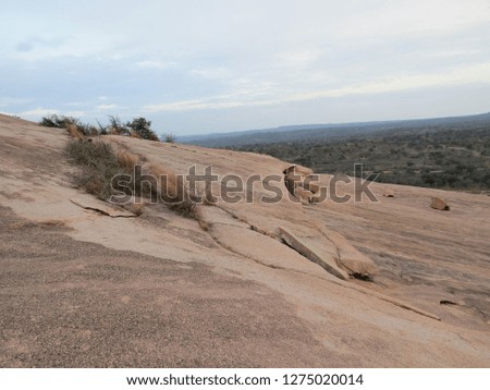 A beautiful, rocky and desert like landscape at Enchanted Rock State Park, Texas