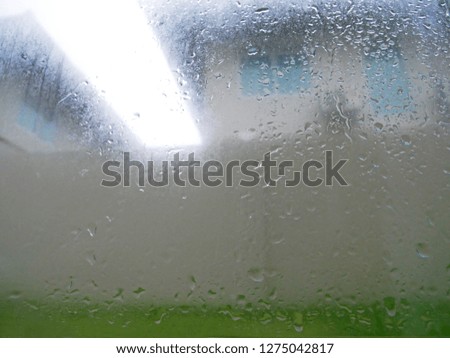 Raining very hard on glass window
