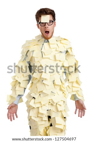 Young male with a sticky note on his face, covered with yellow sticky notes, isolated on white on white