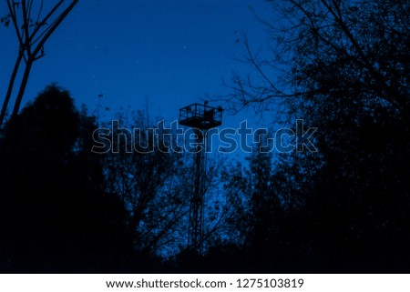 Observation tower of the railway on the background of the night, starry sky