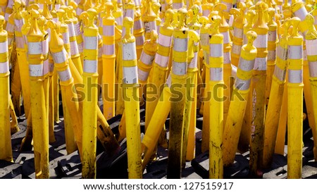 Pile of yellow caution cones used in road construction