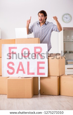 Young man offering home for sale and moving out 