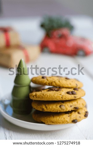 Christmas cookies with chocolate and cocoa on the background of candles.