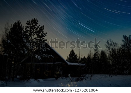 Star tracks over the winter forest