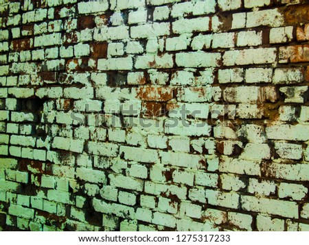 Red brick with white paint texture background. Old stone wall closeup photo. White brick fence. Steady wall. Grungy bricks wallpaper. Shabby stone surface. Rough masonry backdrop. Modern city building