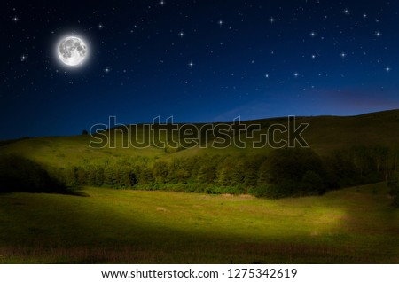 full moon over mountain in the night
