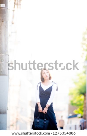 Japanese female model posing for the pictures on the street of Tokyo, Japan. 