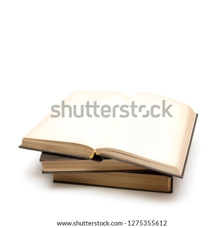 Three books on a white background
