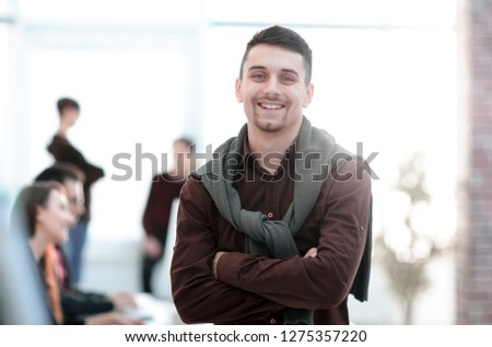 creative businessman on background of office