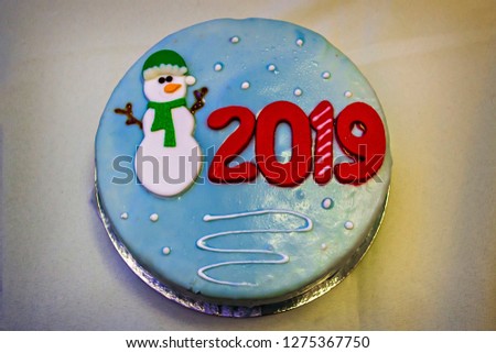 Christmas and New Year 2019 sweet colorful bright cake with snowman
