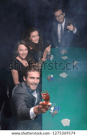 group of friends,spend a free evening in the casino