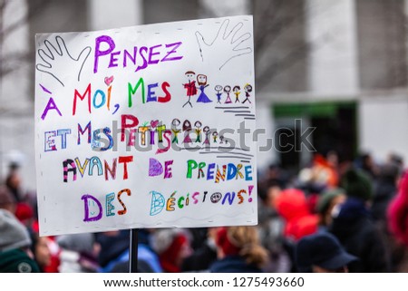 Activists marching for the environment. French sign seen in an ecological protest saying Think about me, my children and my grandchildren, before taking decisions