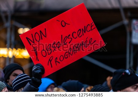 Activists marching for the environment. French sign seen in an ecological protest saying no to planned obsolescence Royalty-Free Stock Photo #1275493885