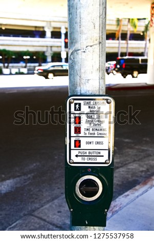 Traffic light button.Use traffic lights at the crossroads. Button of the mechanism lights traffic lights on the street. System control traffic light intersection close.