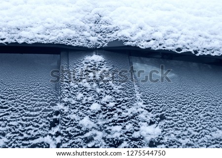 frozen glass of a car on a winter day.
