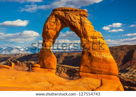 Photographer at Delicate Arch, Arches National Park, Utah Royalty-Free Stock Photo #127554743